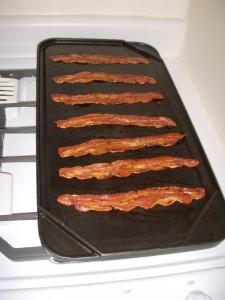 Turkey bacon cooking on the griddle
