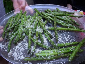 Grilled asparagus covered in grated parmesan cheese