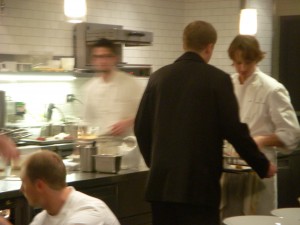 Chef Achatz inspecting a plate before it goes out