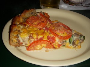 The Lou - fresh spinach, mushrooms, sliced tomatoes, and a mix of mozzarella, romano, and cheddar cheese