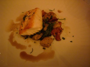 Halibut with crispy gnocchi, spinach, and chanterelles
