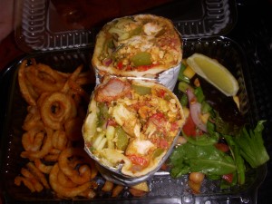 Mixed grill naan sandwich and seasoned curly fries
