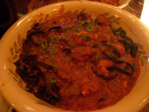 Black spaghetti with shrimp in a spicy tomato sauce