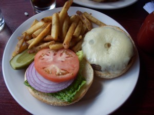 Burger with a thick layer of swiss cheese