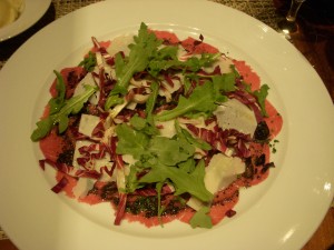 Beef carpaccio with arugula, parmesan, and truffles
