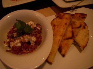 Tuna tartare with pine nuts and pomegranate, served with pita bread