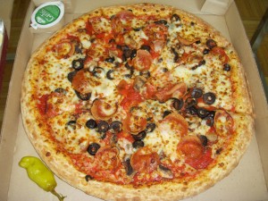 Large pizza with pepperoni, mushrooms, and black olives