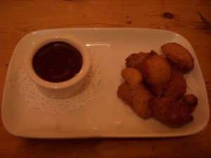 Frittelle with chocolate-basil sauce.