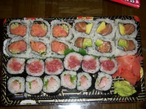 Spicy tuna roll, salmon avocado roll, tuna roll, and yellowtail scallion roll