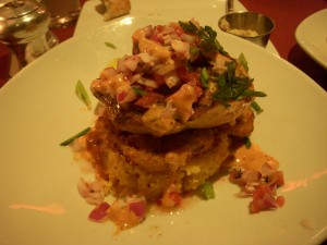 Pan blackened mahi mahi served with fried green tomatoes, white cheddar grits, sherry scallion cream sauce, and lump crab salsa