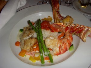 Lobster and grouper over basmati rice with asparagus and diced vegetables