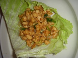 Chicken and pine nuts in a lettuce wrap