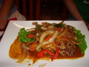Soft shell crab covered in vegetables and herbs