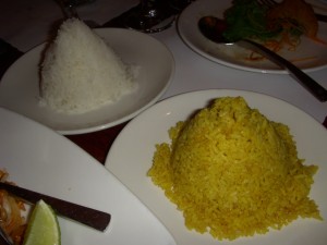 A cone of curry rice and a cone of white rice