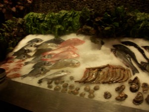 The fish are displayed on ice and you can pick the one you want