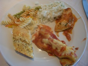 Garlic bread, pasta salad, coconut rice, chicken in tomato sauce, vegetarian canneloni