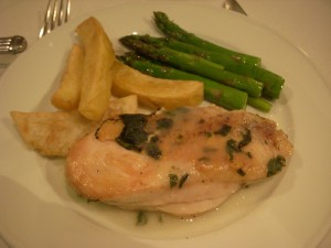Chicken in garlic sauce, potato wedges, asparagus