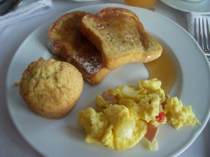 French toast, scrambled eggs with ham, muffin