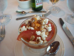 Ceviche topped with popcorn and roasted corn kernals