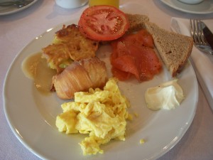 Scrambled eggs, croissant, potato pancake w/applesauce, smoked salmon with tomato, brown bread, and cream cheese