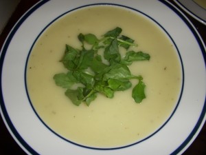 Creamy soup topped with crunchy watercress