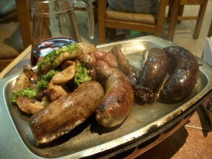 Sausage and blood sausage, plus garlic-topped intestines in the back