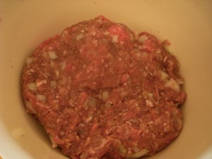 Ground beef mixed with chopped onions and seasonings