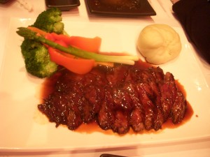 Grilled skirt steak with miso-teriyaki sauce, vegetables, and wasabi mashed potatoes