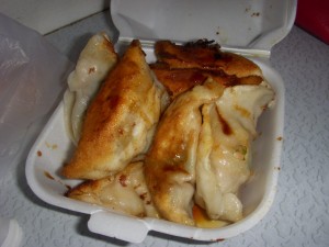 Hot, crispy pan-fried dumplings fresh out of the pan
