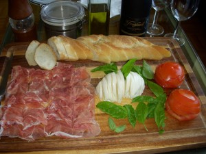 San Daniele prosciutto, fresh mozzarella, basil, tomatoes, and a baguette