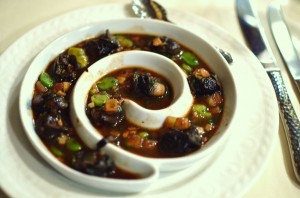Beautifully presented escargot with fresh fava beans