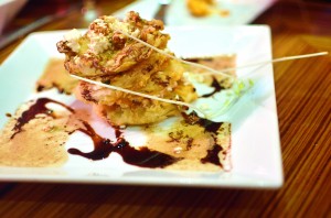 Fried green tomatoes with brown butter, feta cheese, and balsamic
