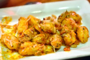 Gnocchi with short rib bolognese, pinenuts, and charred lemon oil