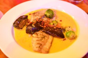 Wood grilled black drum with brussels sprouts and portobella mushrooms