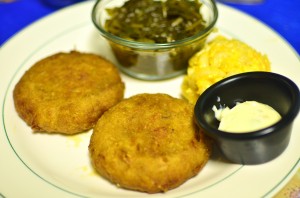 Crab cakes with collard greens and macaroni and cheese