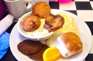 Elle's southern breakfast - fried green tomatoes, grits, eggs, biscuit, sausage