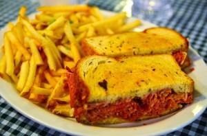 Corned beef sandwich with swiss, and french fries